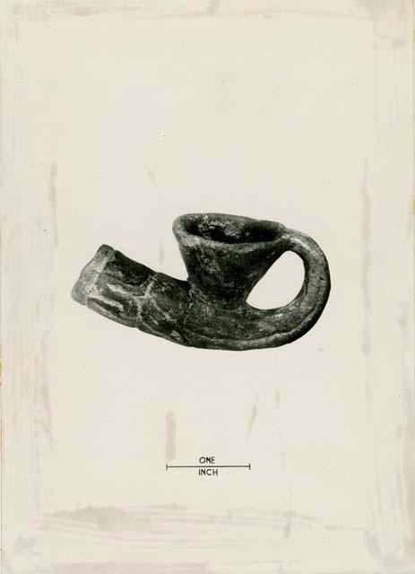 Earthenware pipe with 'handle' probably designed for holding