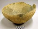 Large complete carinated bowl with complicated stamp