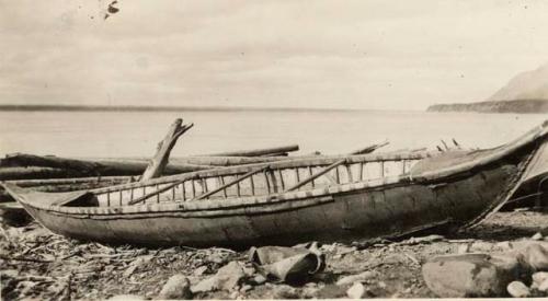 Bark canoe pulled up on the shore