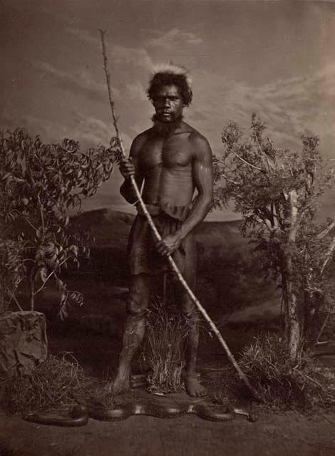 Studio-staged bush scene featuring an Aboriginal man of New South Wales