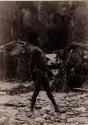 Photo of an Aboriginal Man about to throw a Boomerang