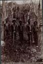 Five Aboriginal "Fighting Men" standing in Bush Land holding Spear Throwers