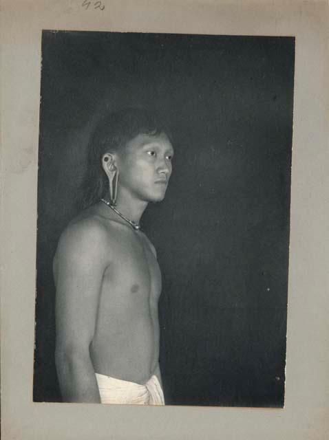 Portrait of young man with stretched lobes