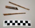 Cane and 2 wooden (?) artifacts