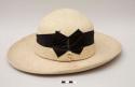 Indian daily-wear hat; white wool felt with black ribbon; insect damage