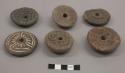 Spindle whorls with incised designs