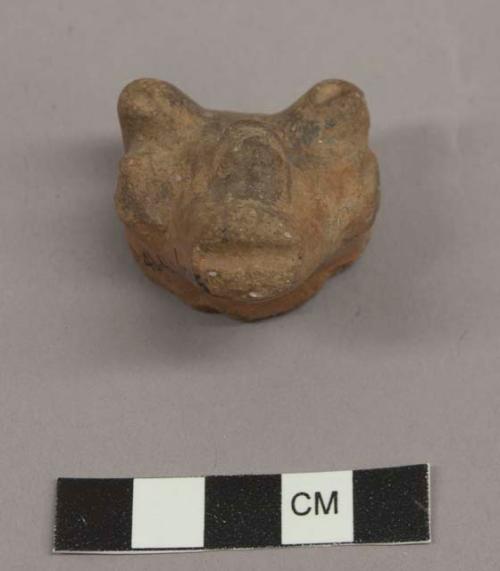 Tripod pottery leg in form of animal's head