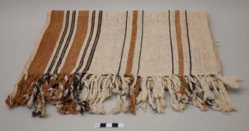 Woven textile; ecru, brown and black bands with twisted fringe