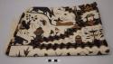 Batik textile, ivory with pattern of animals, structures, florals and insects