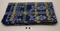 Sikka textile; indigo with yellow and green plaid, white ikat floral design