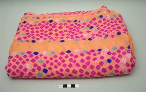 Textile; salmon ground with pink tie-dye designs