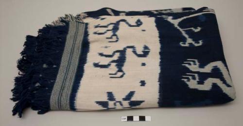 Indigo and white textile with ikat designs of animals, including horses; hinggi?