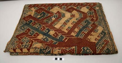 Woven textile, palepai; tan with dark blue and dark red supplementary weft design of ship