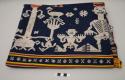 Textile; bands of dark blue, red and yellow with supplementary brocade of ancestors, animals and designs in yellow, red and white