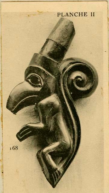 Studio shot of a sculptured whistle representing a bear with a crow's head