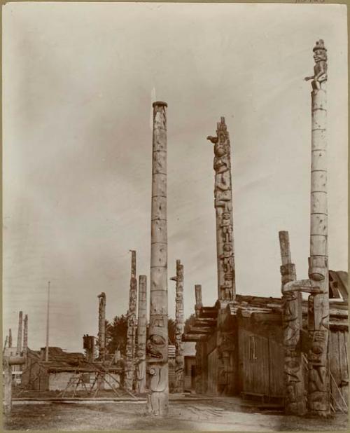 View of village with wooden houses and many totem poles