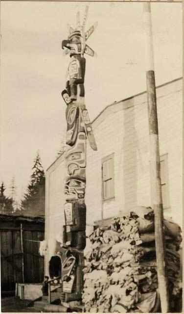 Totem pole in front of building