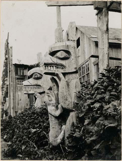 Totem poles at entrance to house
