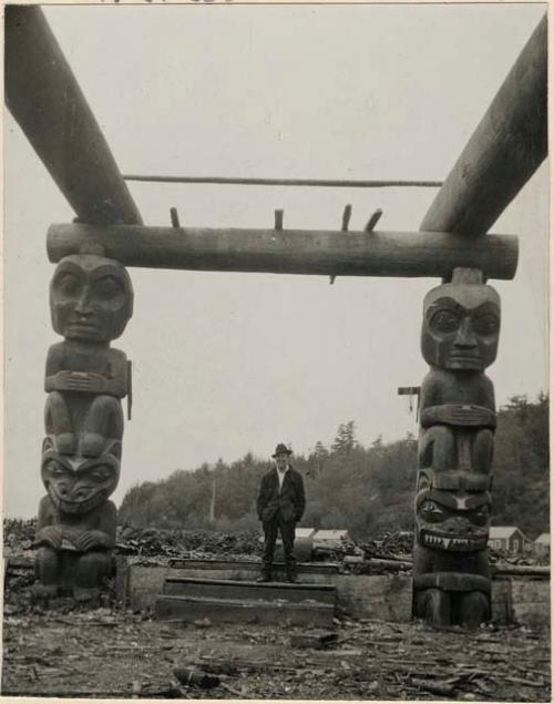 House posts and a man standing between them