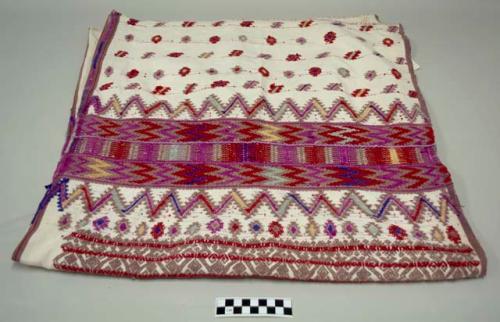 Huipil, woman's shirt, white with red, pink, purple, yellow, and green geometric designs