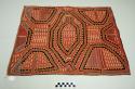 Mola, rectangular pannel, red background with orange, black, white, and blue geometric designs