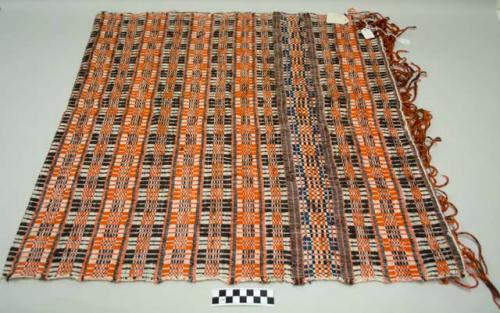 Mantel, table cloth, white with orange, black, and blue geometric designs, fringes