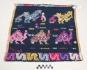 Tzute, multipurpose cloth, dark blue with variety of multicolored animals and the word "Cantel"