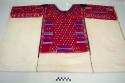 Huipil (ceremonial), women's shirt, three panels, white with red geometric designs in rectangles on front, back, and shoulders, black taffeta triangles around neck and circles on shoulders