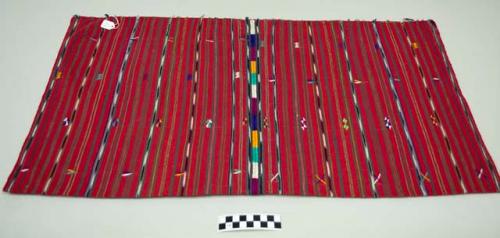 Tzute, men's headdress, two pieces joined by a randa, red with multicolored geometric images and black and white ikat