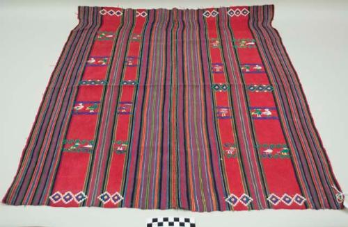Tzute, women's multipurpose headcloth, two pieces sewn together, red with multicolored stripes in the middle and on the edges, multicolored animal, floral, and geometric mages.