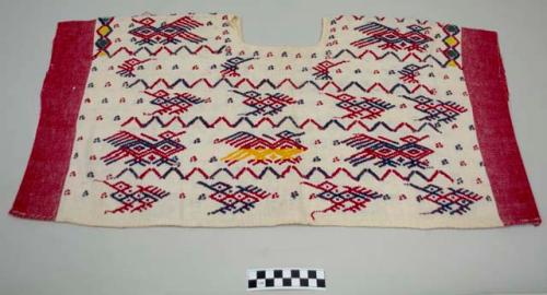 Huipil, women's shirt, short, head hole cut square and sides sewn, white with wide red bands at edges, red and blue birds and dots