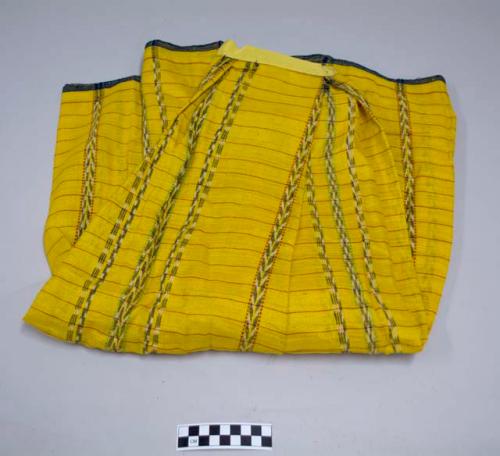 Skirt, pleated with an attached waistband, yellow with red horizontal stripes, black and white ikat and red vertical stripes