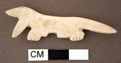 Shell effigy, carved and incised, possible stylized animal