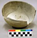 Bowl, 7.5 in diameter. Black on white ware. Parallel circle decoration around