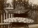 Aboriginal Coolamon and Small Decorated Canoe