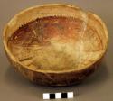 Ceramic bowl, brown on buff interior and exterior, mended, damaged rim