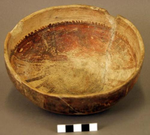 Ceramic bowl, brown on buff interior and exterior, mended, damaged rim