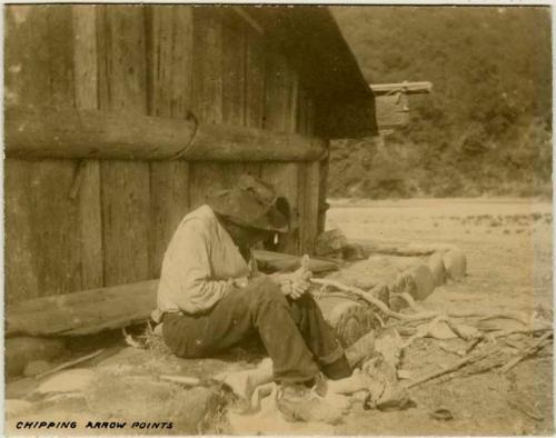 Man chipping arrow points