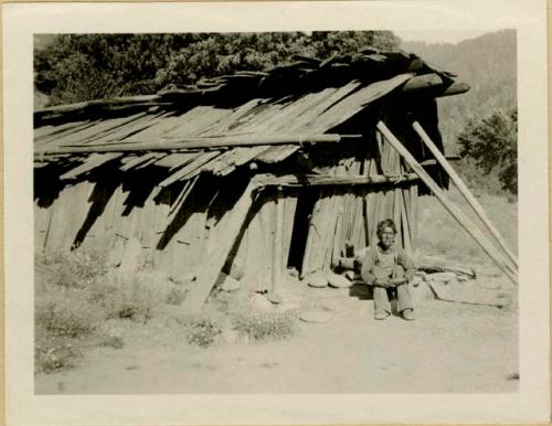 Billy Works in front of his old house