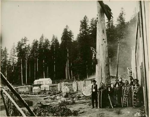 Eight men and women dressed for a dance. Indian village - Waltese - and dance party