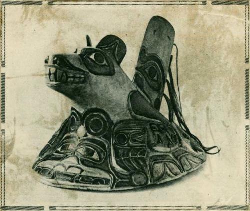 News clipping showing a dance hat carved from wood and painted