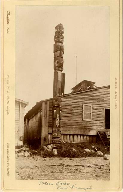 Totem pole outside hut