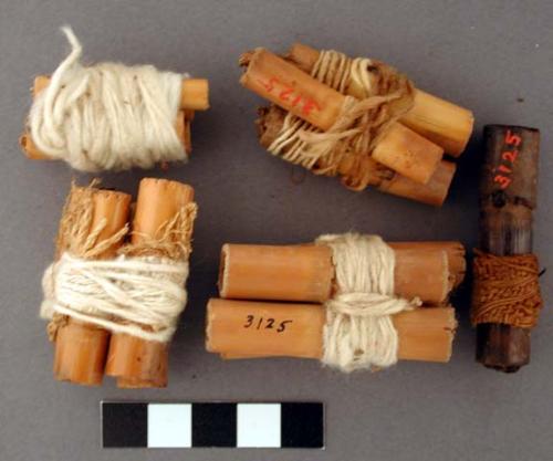 Wood, Cane cigarettes, wrapped in cotton fabric and knotted twine, some gathered