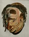 Mask from Melanesia depicting a man's face painted white with red contour lines
