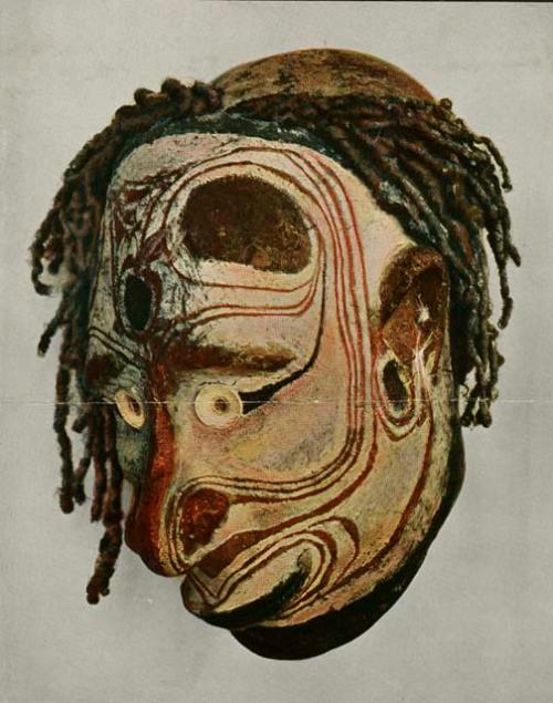 Mask from Melanesia depicting a man's face painted white with red contour lines