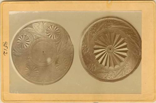 Carved discs (with curvilinear design)