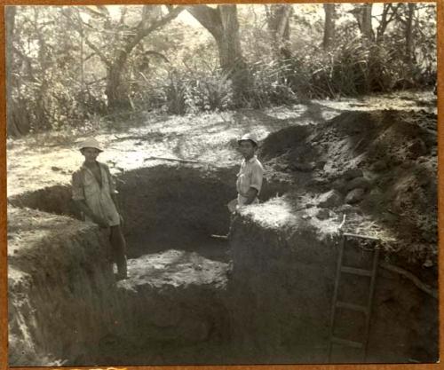 Archaeologists excavating Cut 5, looking SE