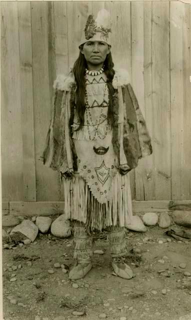 Thompson River Indian woman "Christine TsEkenelxEmux" in native costume, including pelt coat