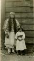 Thompson River Indians (Salishan) in costume, a woman and a young girl