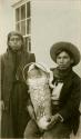 Thompson River Indian man "Talan" and wife "Lena" with their baby in carrier